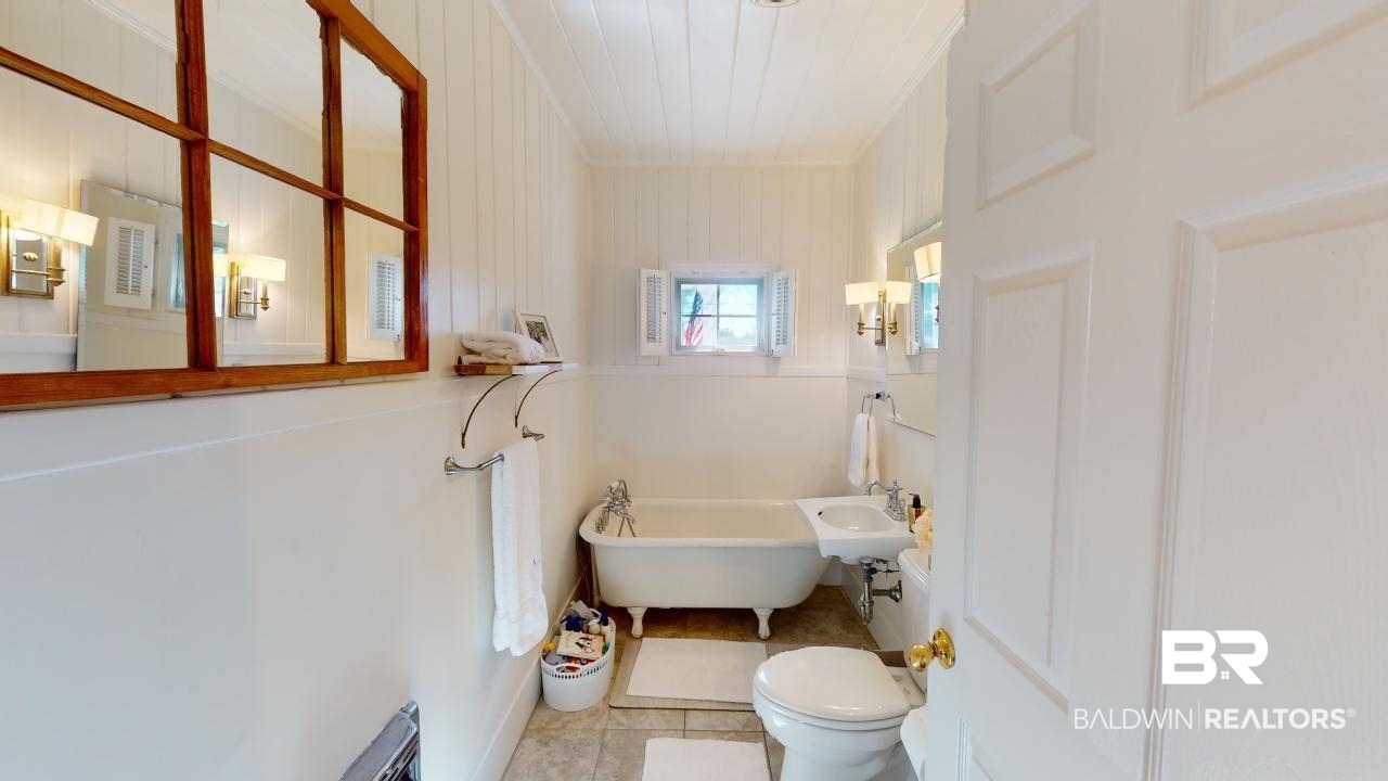 4358 Stein Street Mobile, AL 36608 - Photo 10 of 29 Bathroom with tile patterned flooring, toilet, and a bathtub