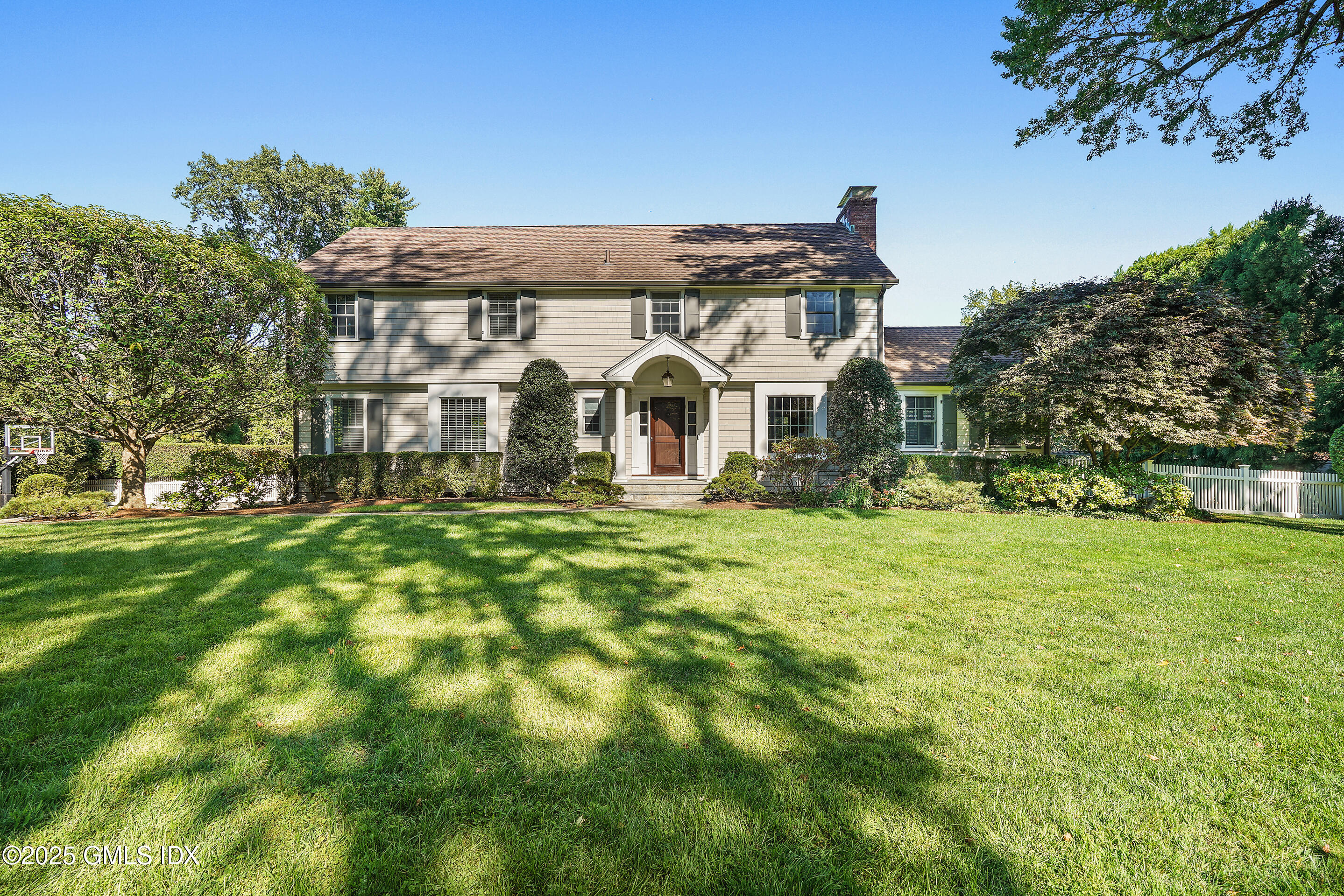 41 Winthrop Drive Riverside, CT 06878 - Photo 2 of 8 a front view of a house with a garden