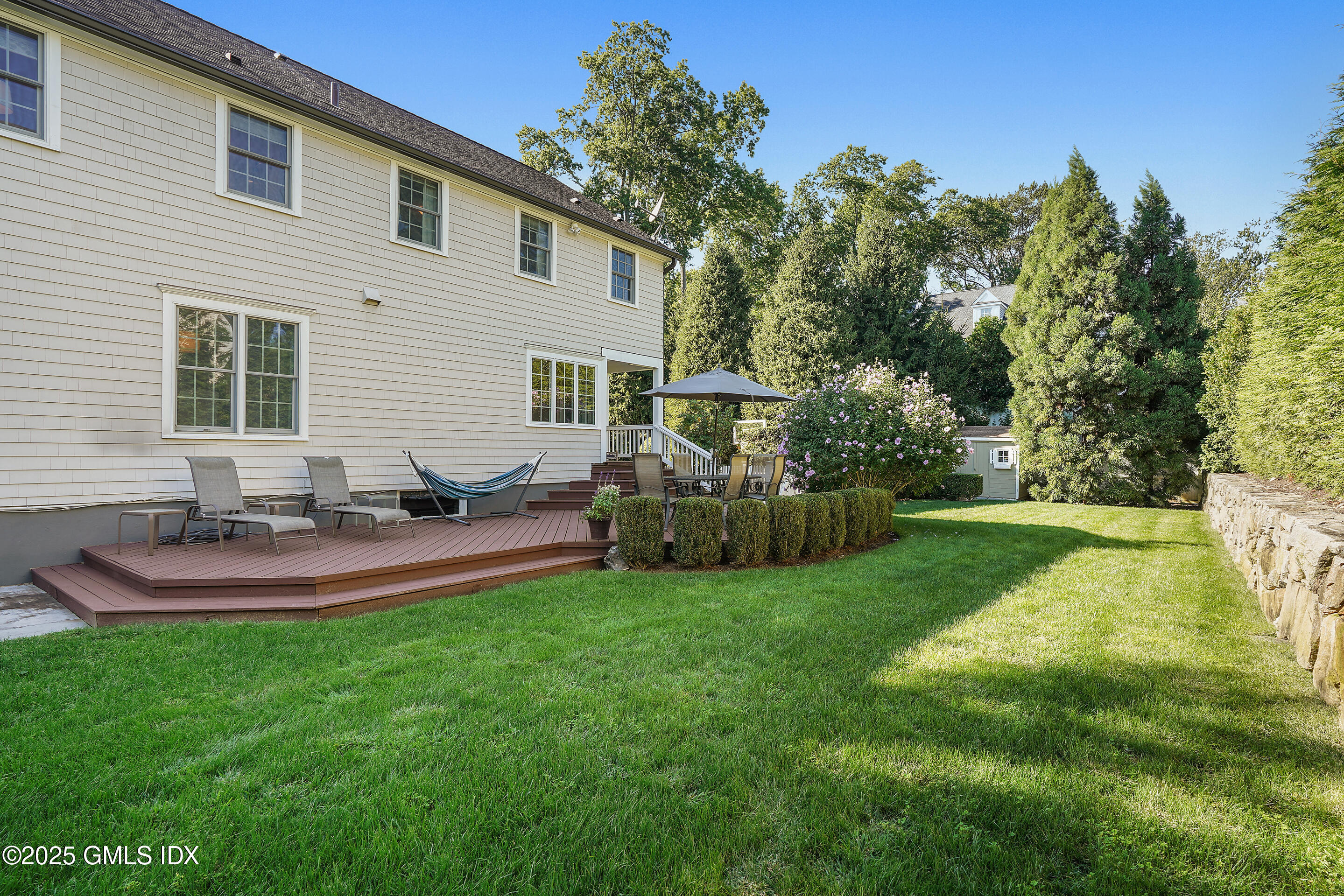 41 Winthrop Drive Riverside, CT 06878 - Photo 4 of 8 a view of a house with backyard and sitting area
