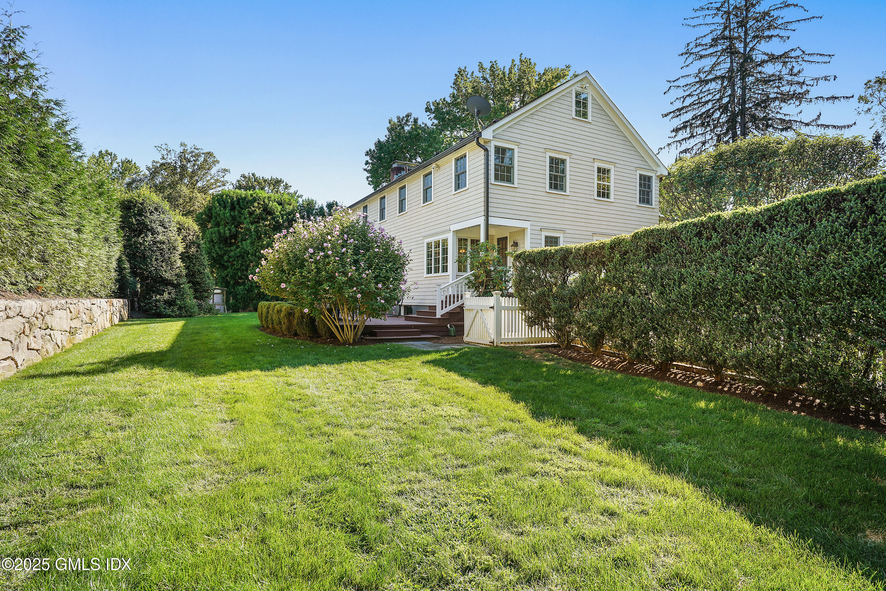 41 Winthrop Drive Riverside, CT 06878 - Photo 6 of 8 a front view of house with yard and green space