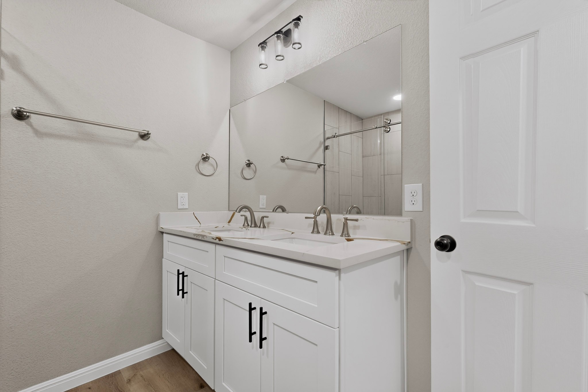 158 Fealy Road Red Rock, TX 78662 - Photo 23 of 40 Clean lines and a spacious dual vanity define this modern bathroom space.