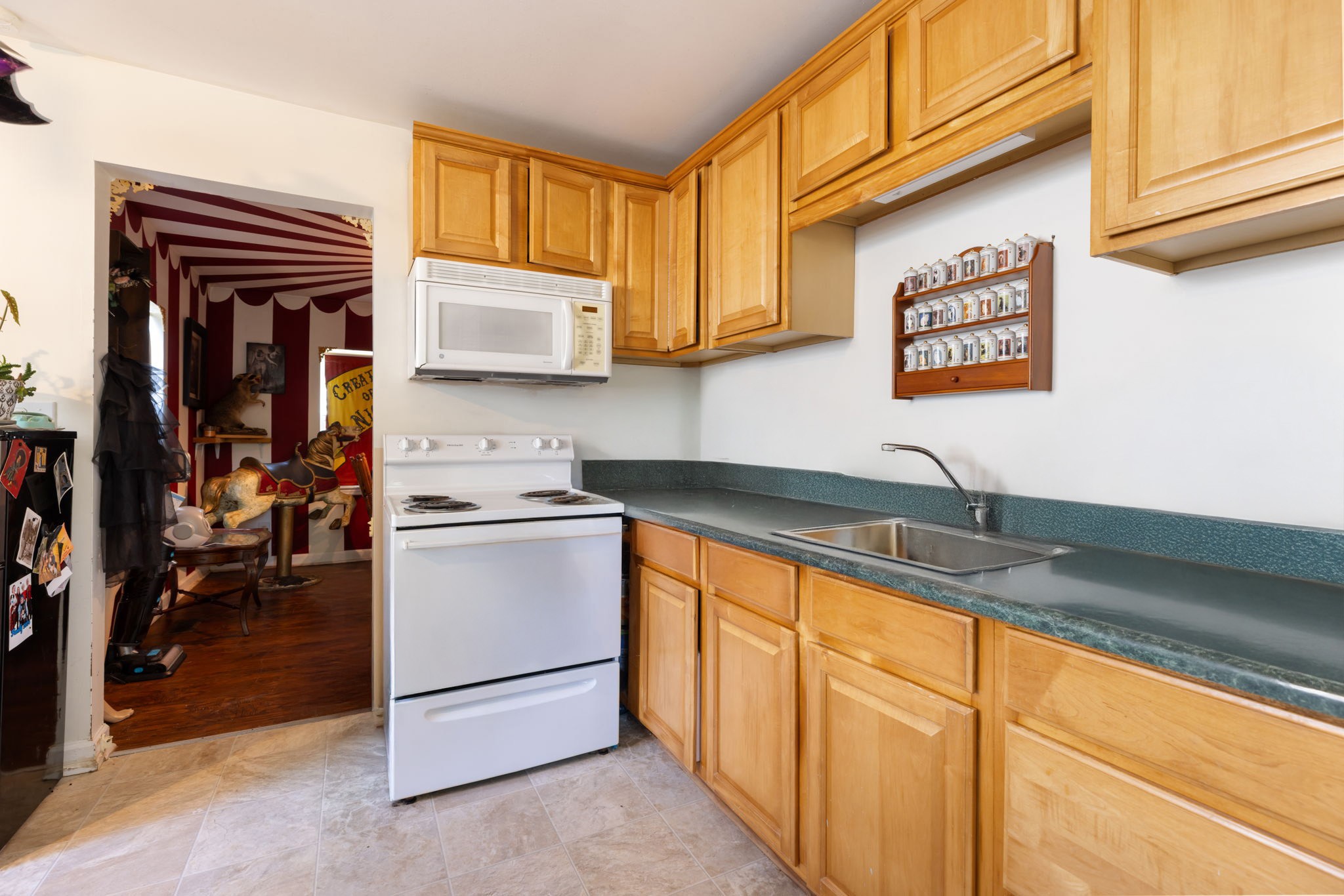 532 East Maple Street Madison, TN 37115 - Photo 5 of 14 a kitchen with stainless steel appliances granite countertop a sink and a stove
