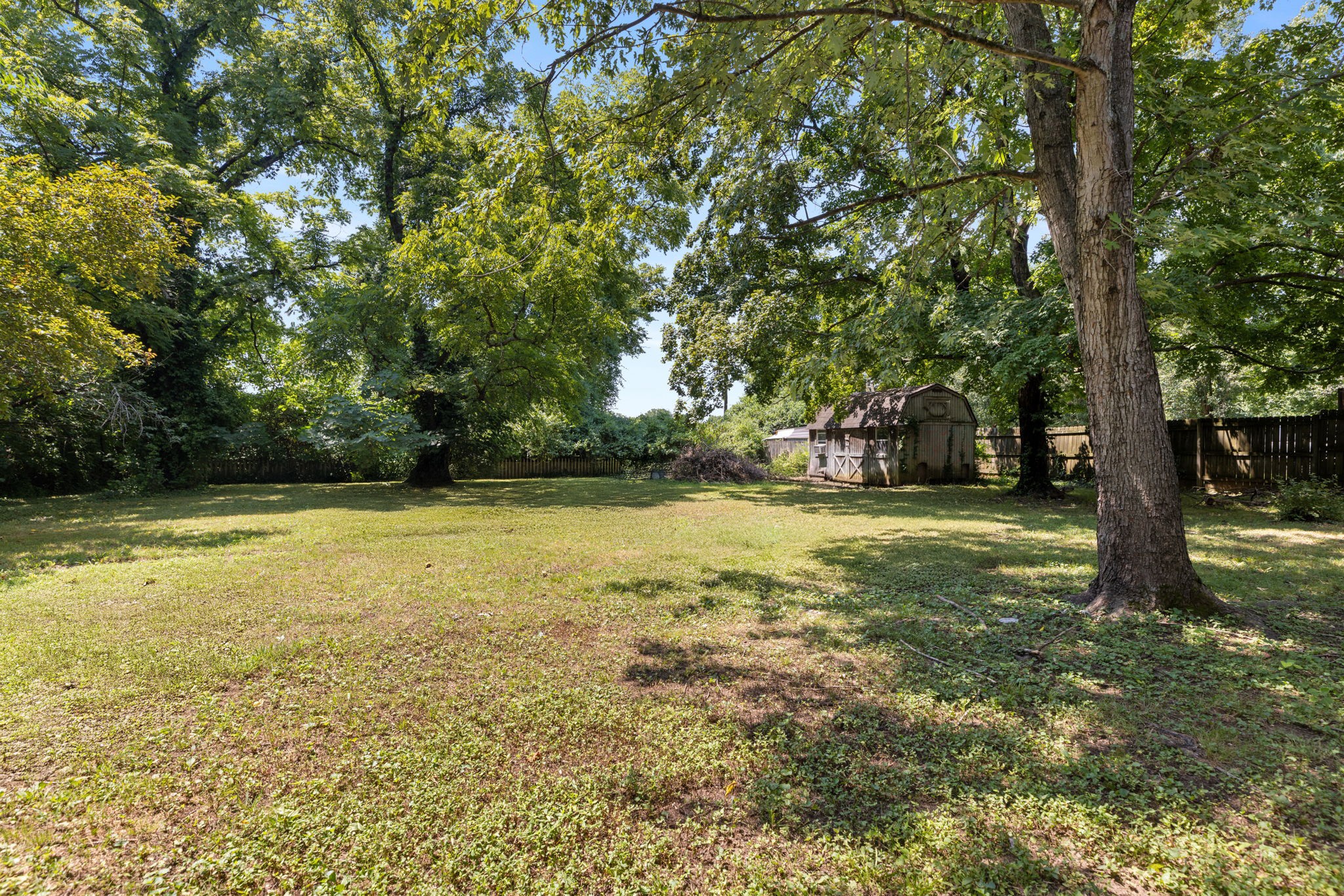 532 East Maple Street Madison, TN 37115 - Photo 6 of 14 a view of outdoor space with deck and trees