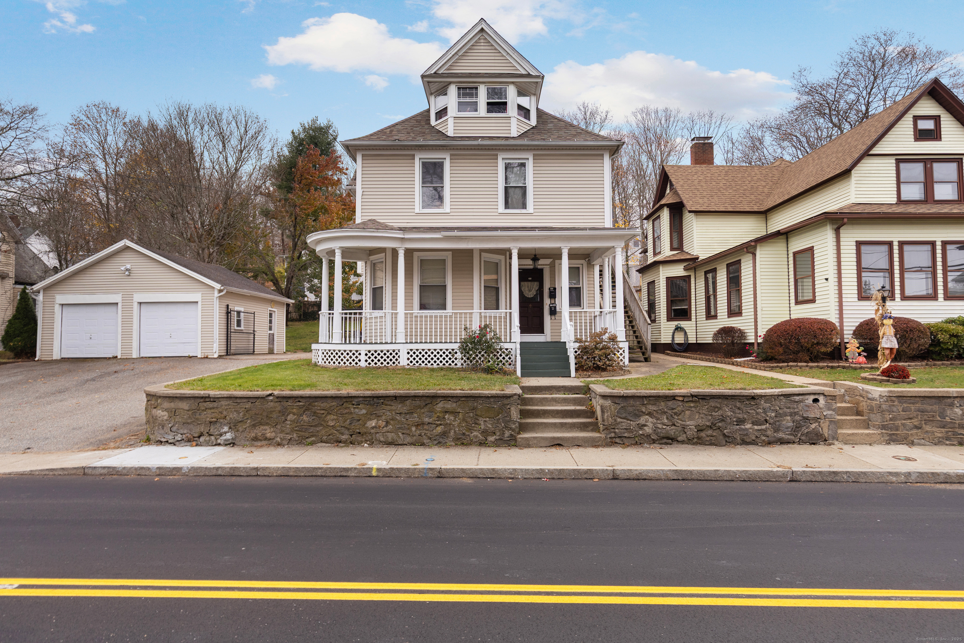 a front view of a house with a yard