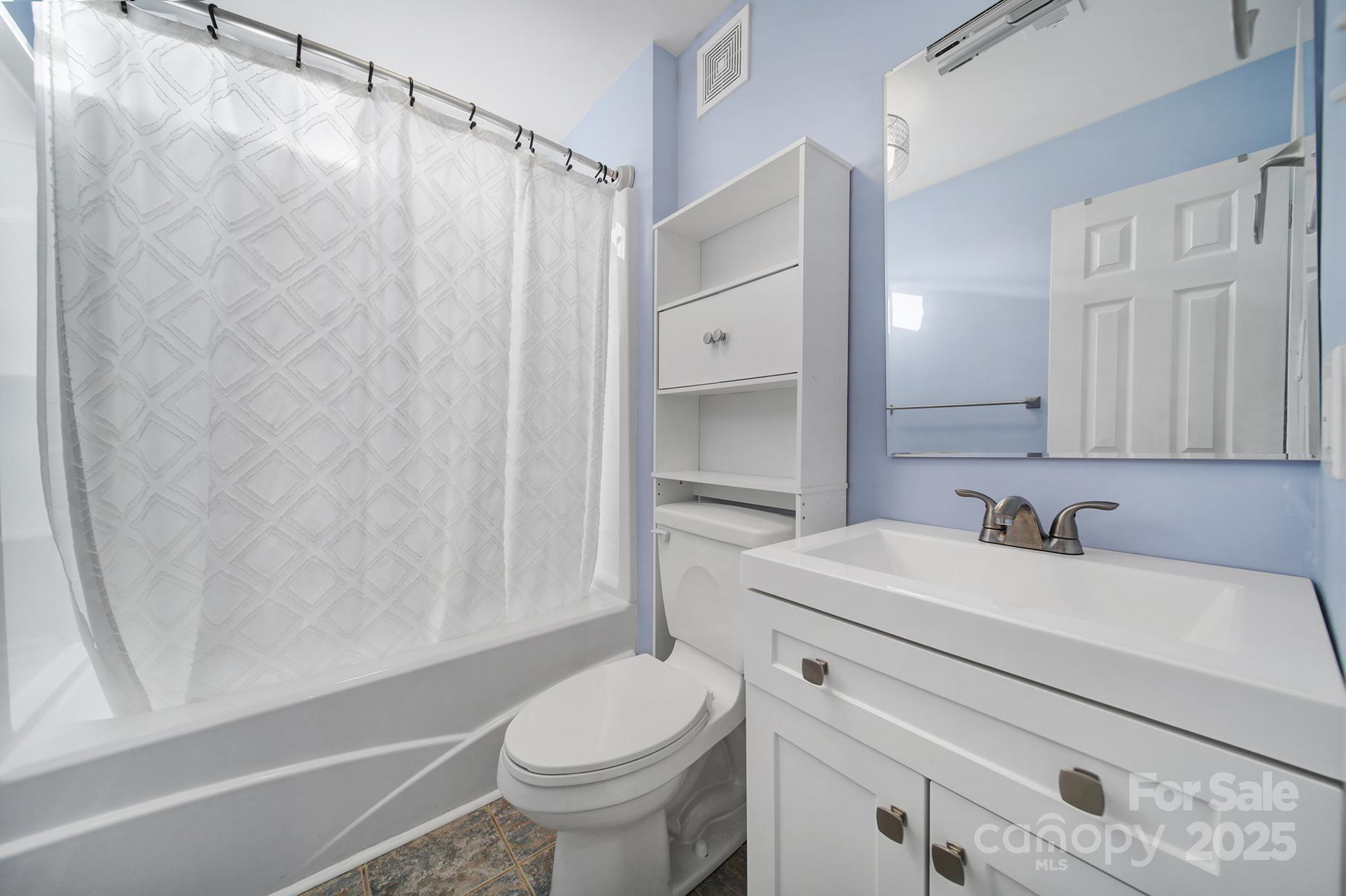 1019 Palmyra Drive Tega Cay, SC 29708 - Photo 15 of 42 a bathroom with a sink toilet and shower