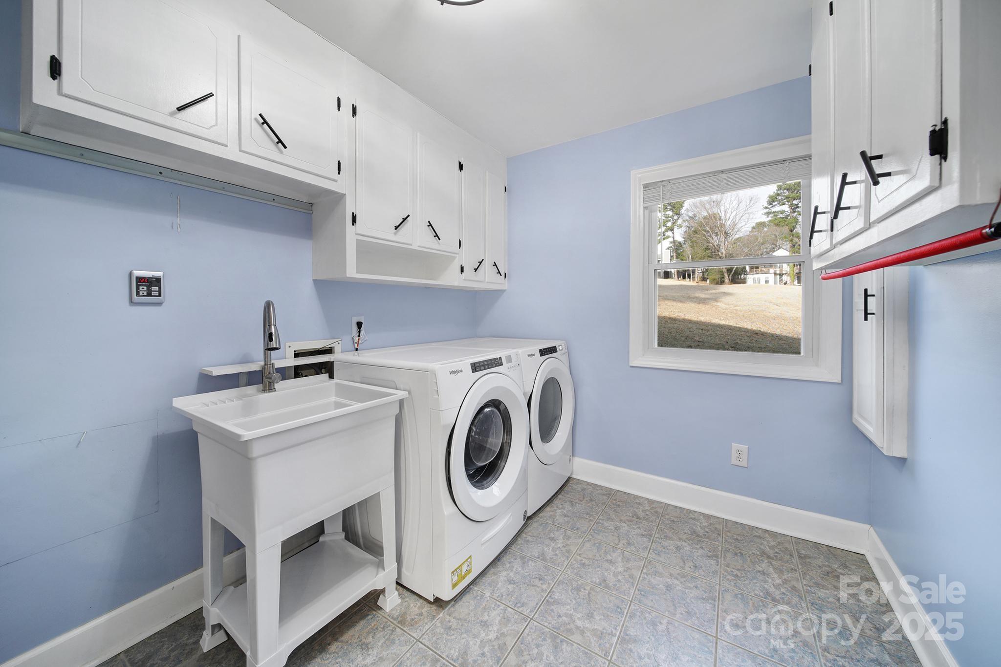 1019 Palmyra Drive Tega Cay, SC 29708 - Photo 16 of 42 a utility room with dryer and washer