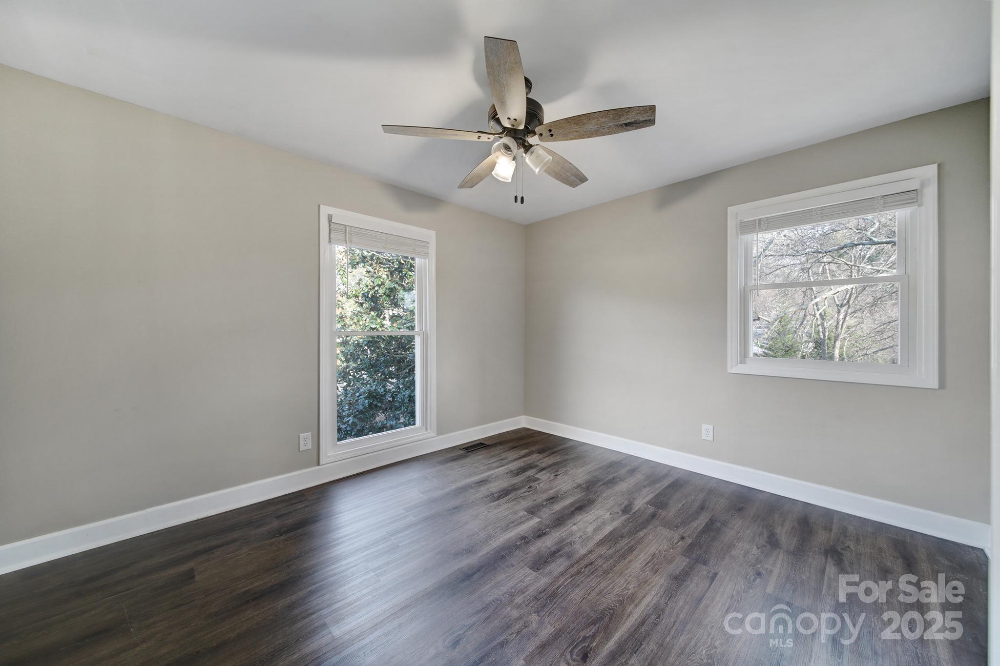 1019 Palmyra Drive Tega Cay, SC 29708 - Photo 23 of 42 a view of an empty room with wooden floor and a window