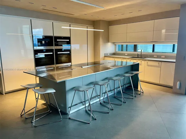 a bedroom with a bed and a potted plant