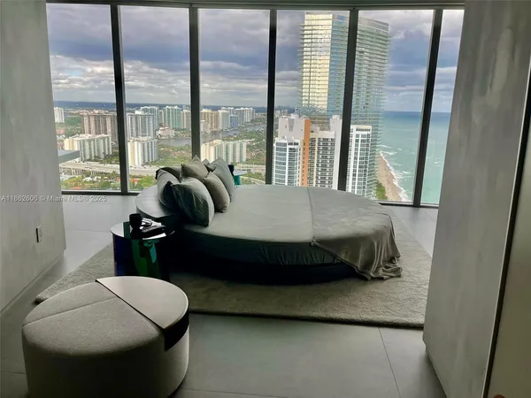 a bed sitting in a room next to a bathroom