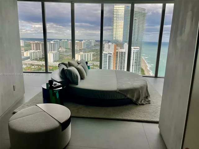 a bed sitting in a room next to a bathroom