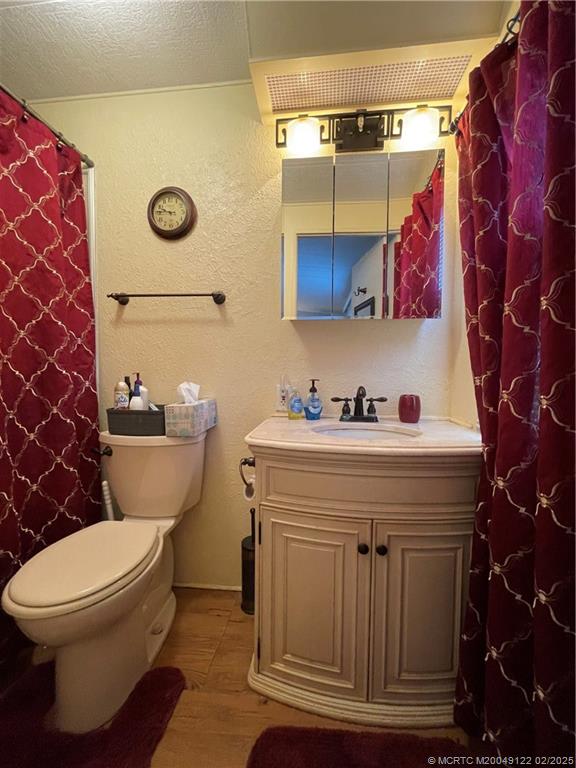 14663 Southwest Rake Drive Indiantown, FL 34956 - Photo 30 of 36 a bathroom with a toilet and a sink