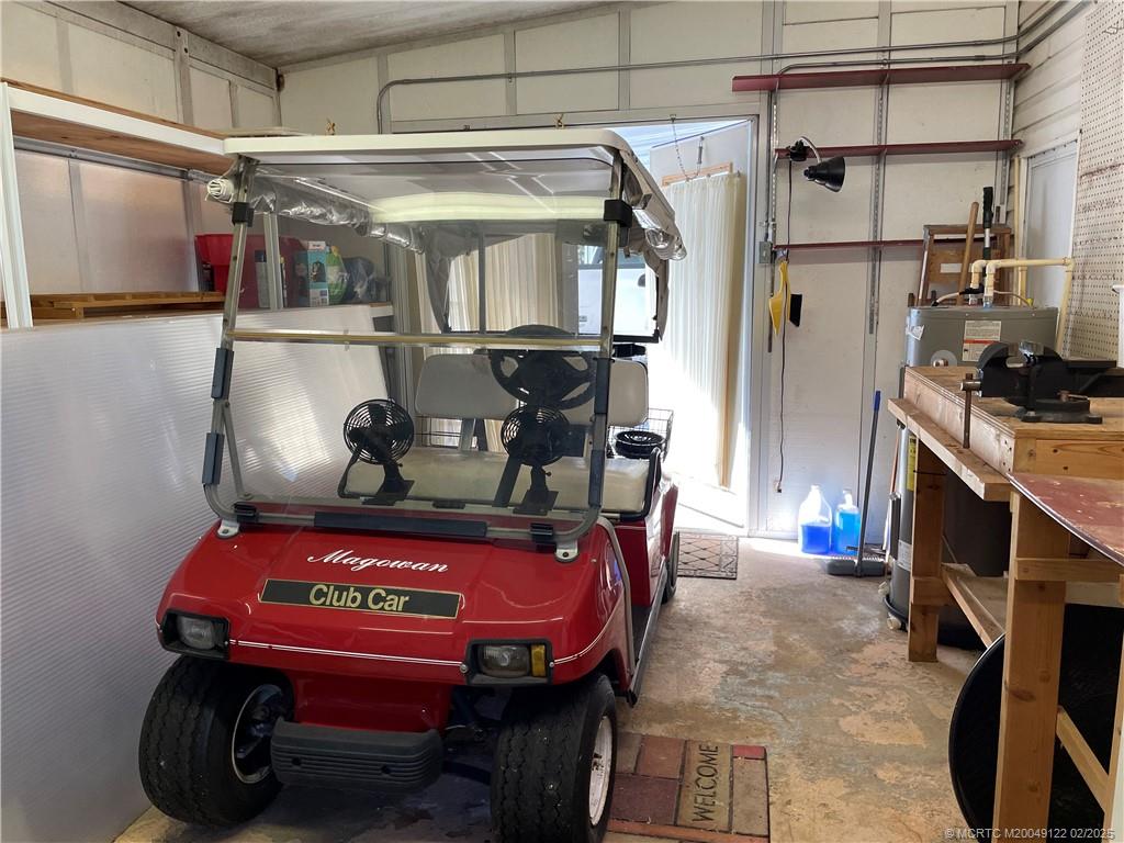 14663 Southwest Rake Drive Indiantown, FL 34956 - Photo 32 of 36 a view of electric room with air conditioner and furniture