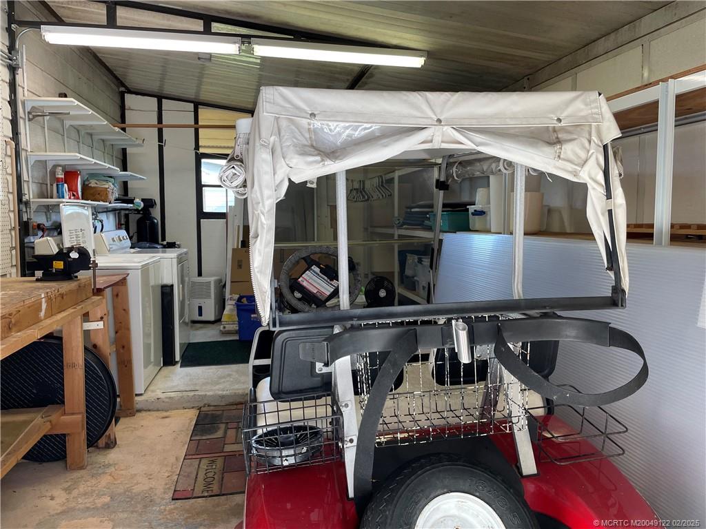14663 Southwest Rake Drive Indiantown, FL 34956 - Photo 33 of 36 a kitchen with table and chairs