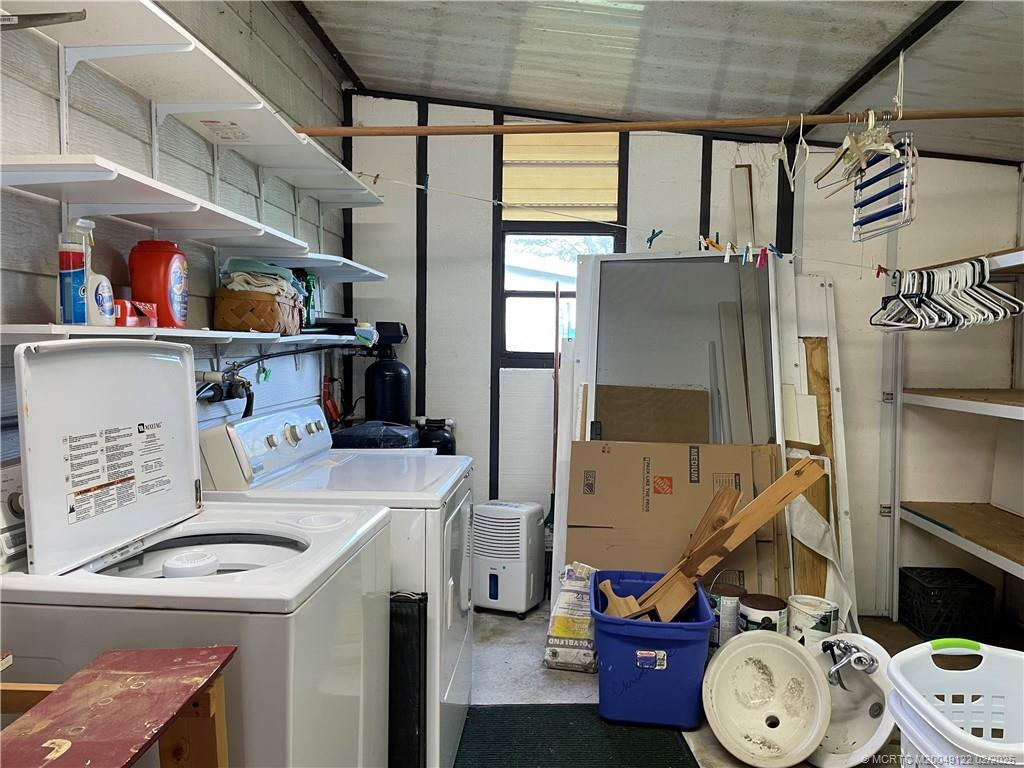 14663 Southwest Rake Drive Indiantown, FL 34956 - Photo 34 of 36 a utility room with dryer and washer