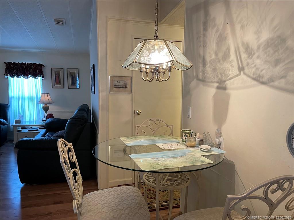 14663 Southwest Rake Drive Indiantown, FL 34956 - Photo 9 of 36 a dining room with furniture and window