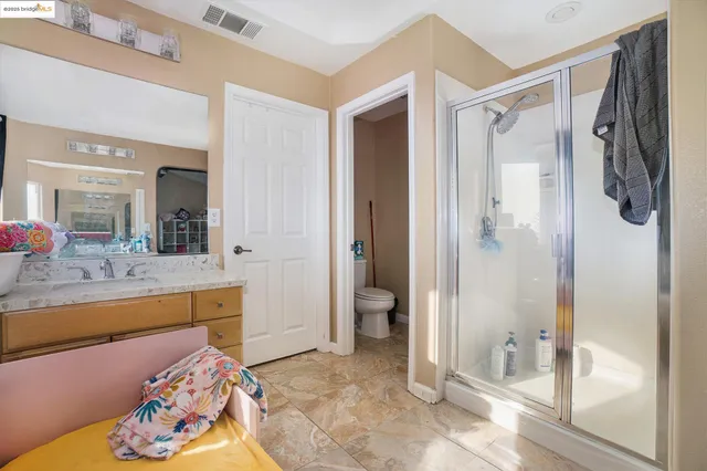 a spacious bathroom with a tub and shower