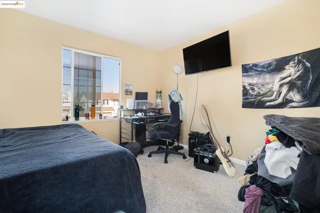 a room with furniture and a flat screen tv