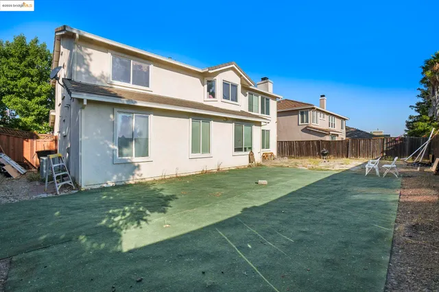 a view of a backyard with a slide