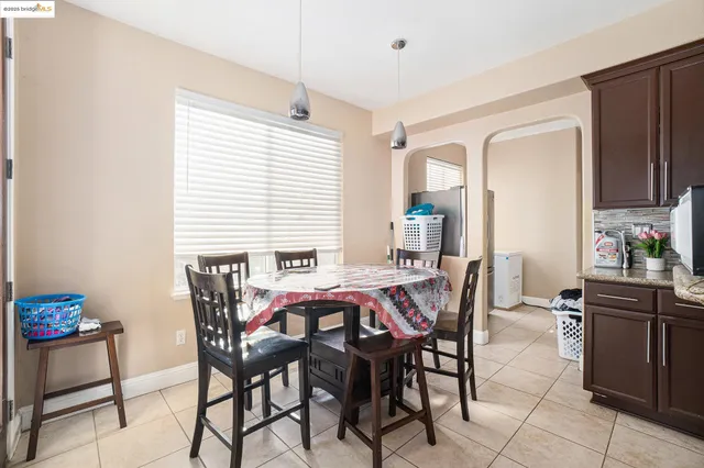a dining room with furniture and window