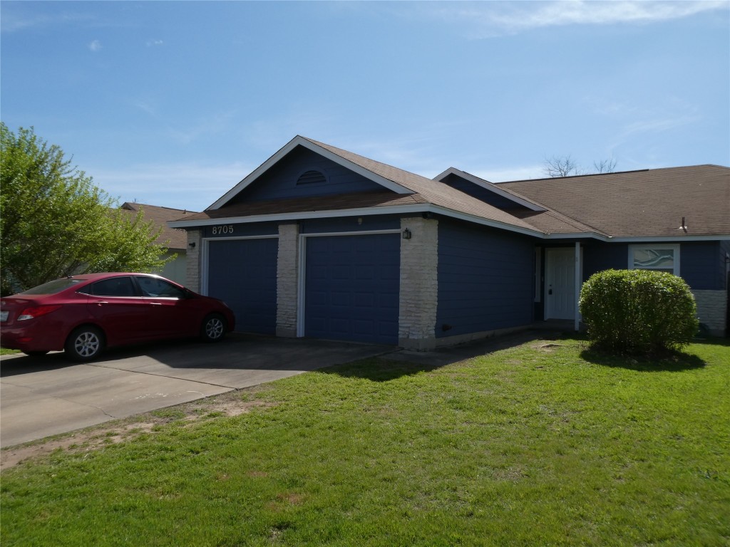 a house view with a garden space