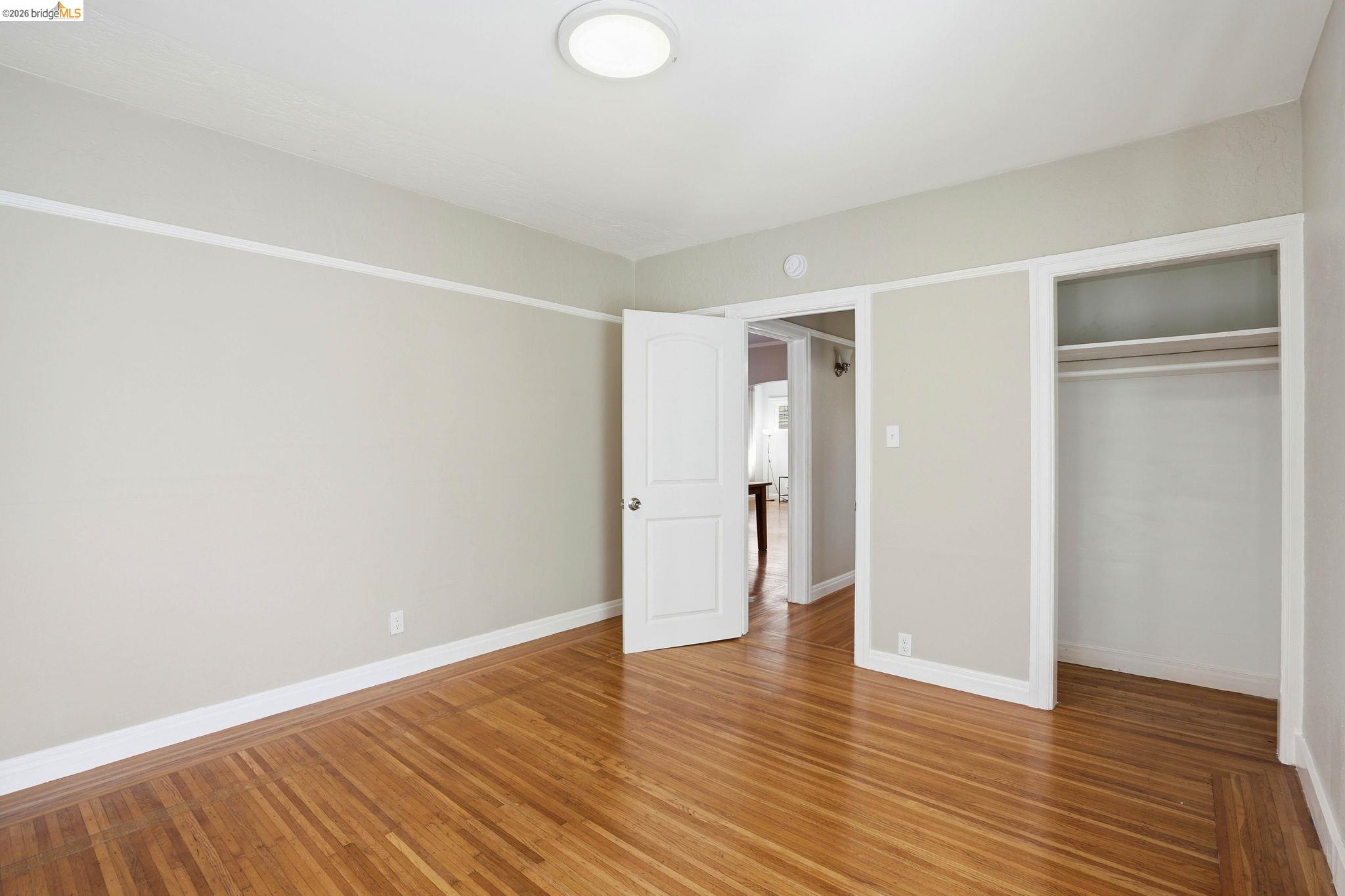 840 Key Rte Boulevard Albany, CA 94706 - Photo 17 of 42 a view of an empty room with wooden floor