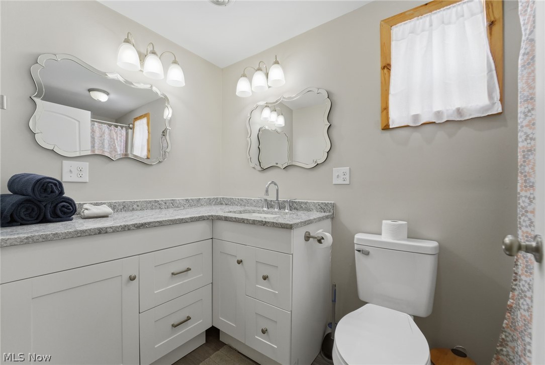 5919 Lake Road West, Unit 33 Ashtabula, OH 44004 - Photo 10 of 22 Bathroom featuring vanity and a shower with curtain