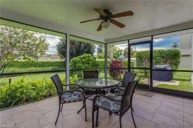 a dining room with furniture and garden view