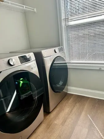 a utility room with dryer and washer