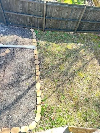 a view of a balcony with a large window and wooden floor