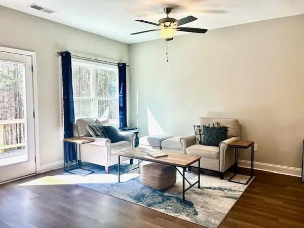 a living room with furniture and a window