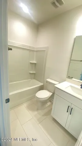 an aerial view of a house a swimming pool outdoor seating and outdoor seating