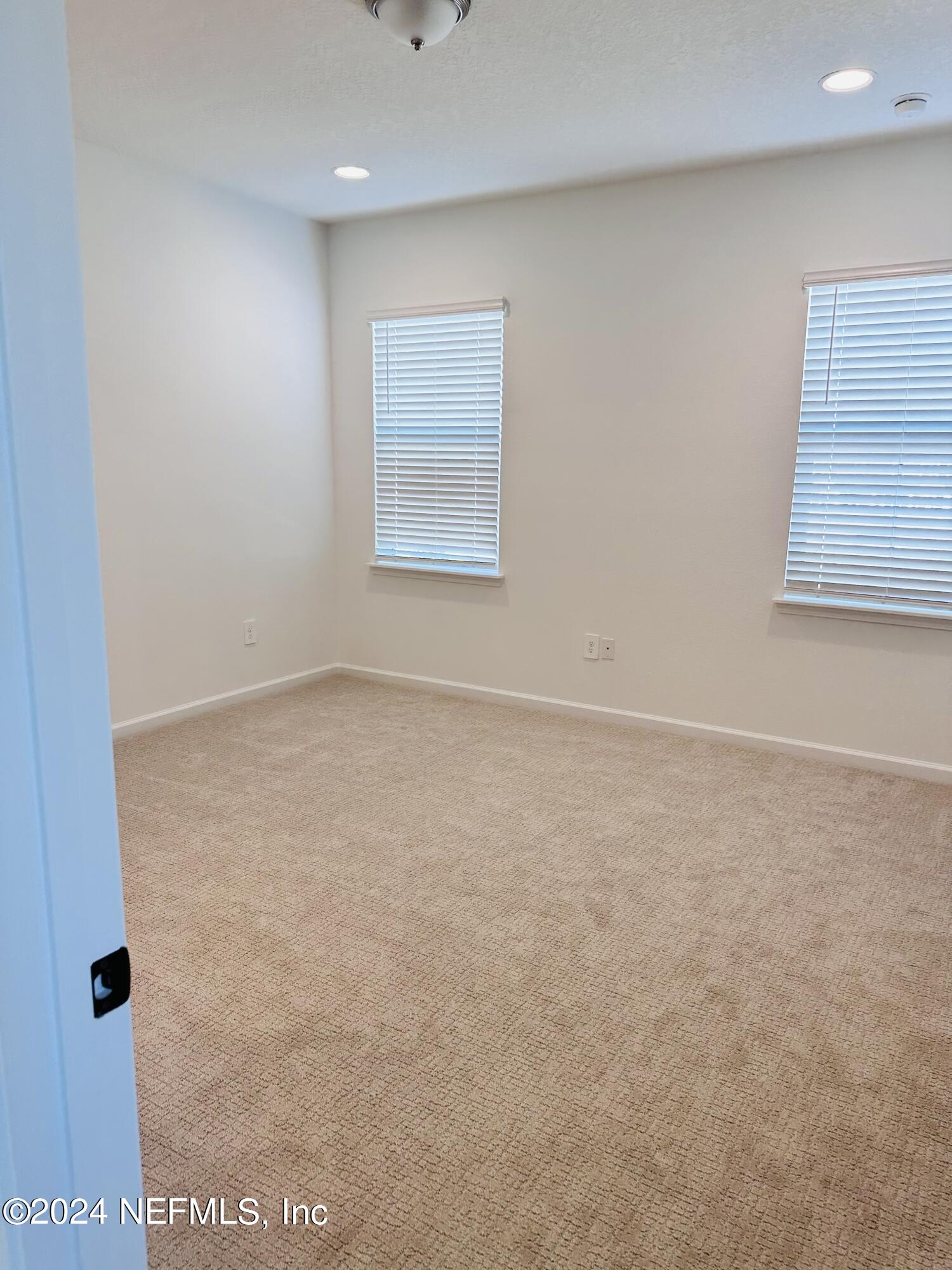 173 Wood Breeze Way St. Augustine, FL 32092 - Photo 16 of 36 an empty room with a workbench