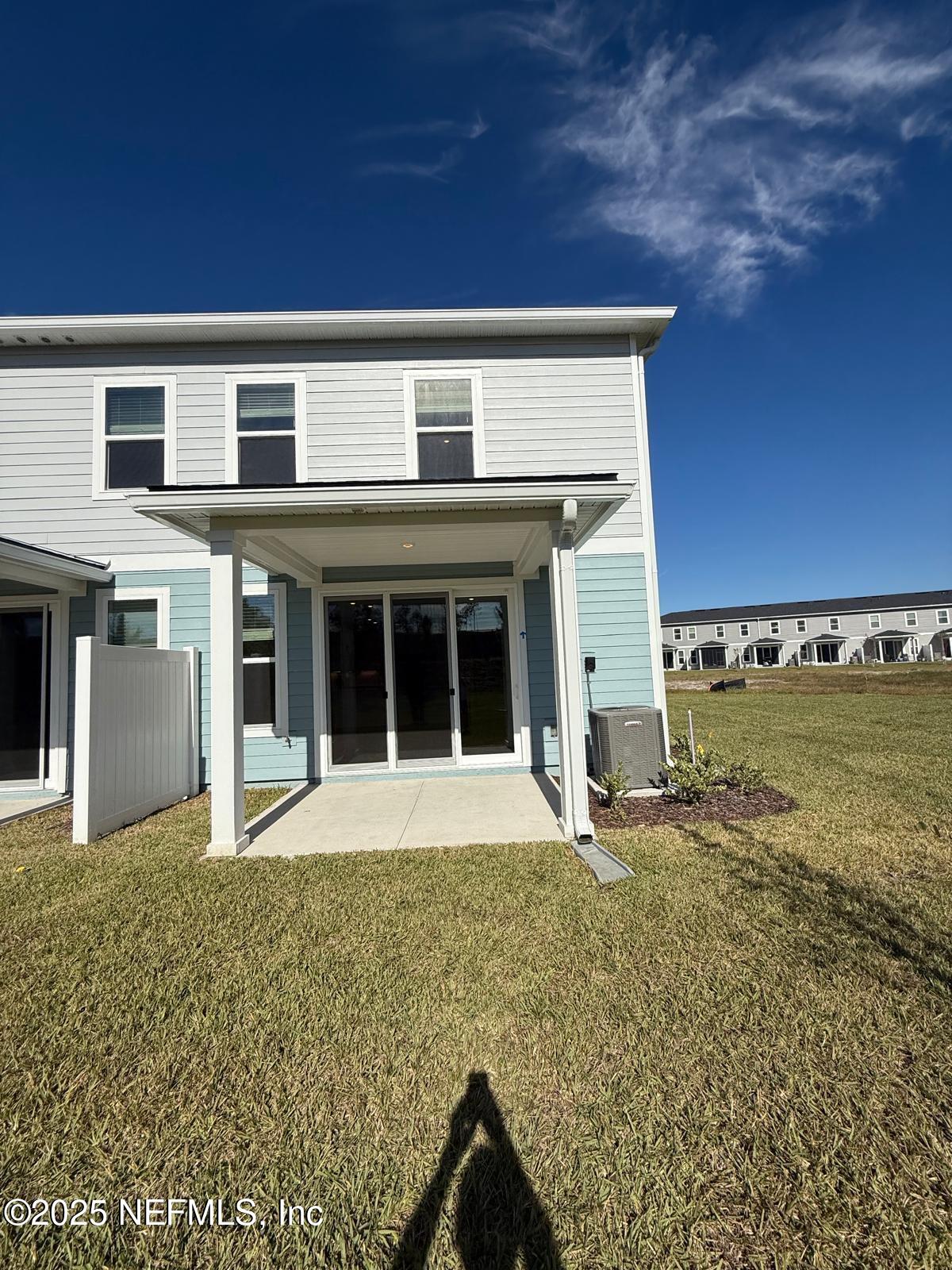 173 Wood Breeze Way St. Augustine, FL 32092 - Photo 26 of 36 a front view of a house with a yard