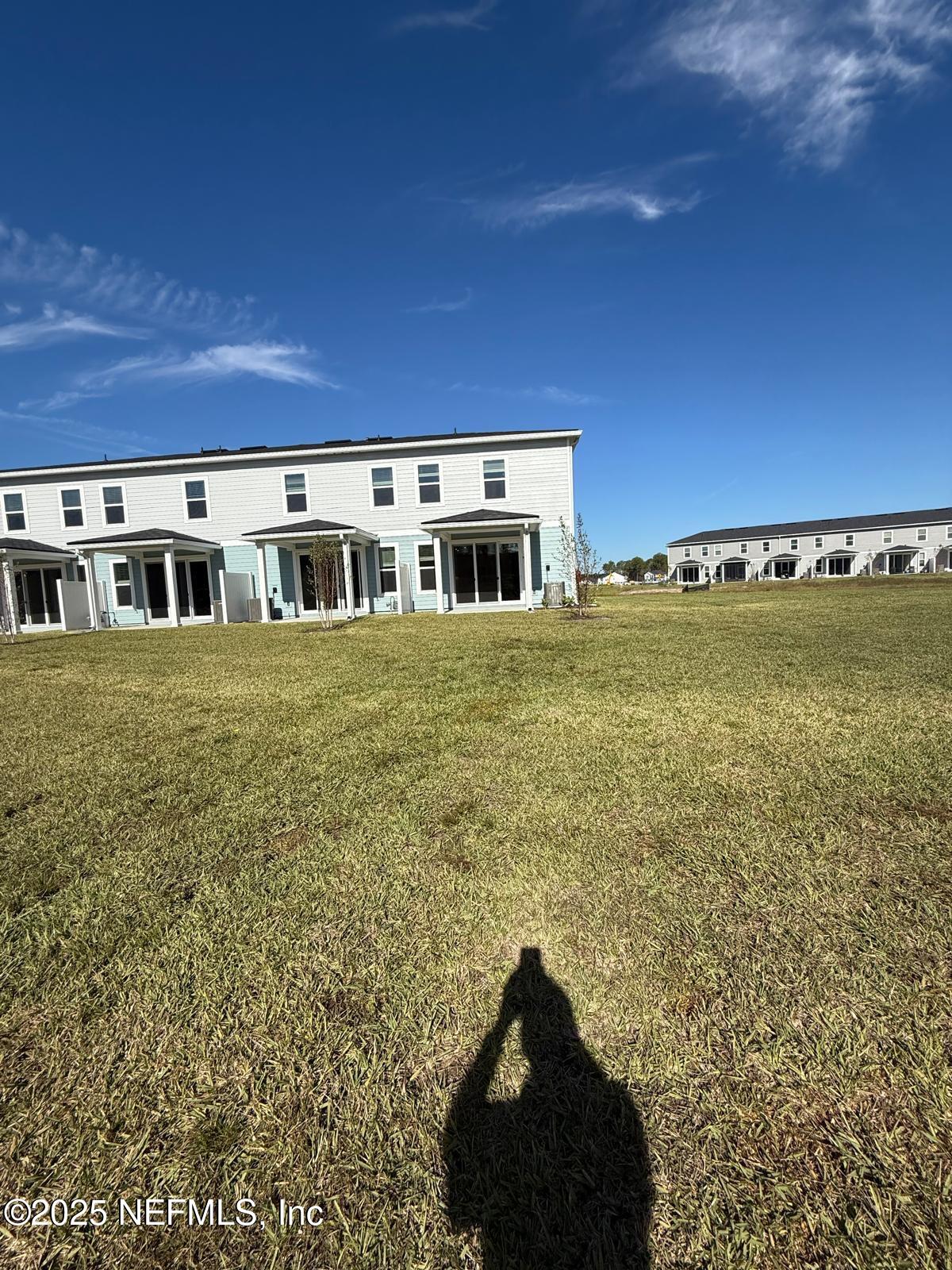 173 Wood Breeze Way St. Augustine, FL 32092 - Photo 27 of 36 a view of a house with a yard