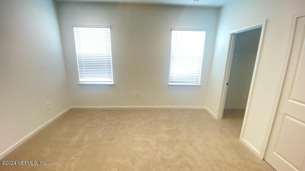 173 Wood Breeze Way St. Augustine, FL 32092 - Photo 7 of 36 a view of an empty room with a window