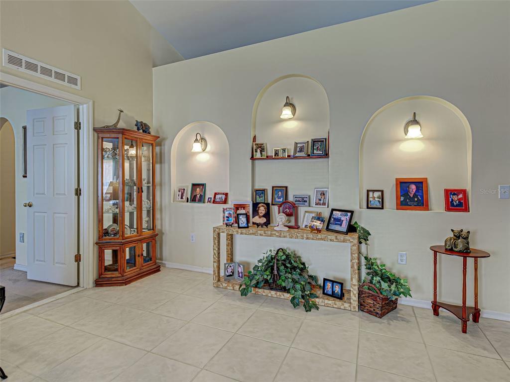 3139 Point Street North Port, FL 34286 - Photo 16 of 58 a very nice looking room with a mirror and furniture