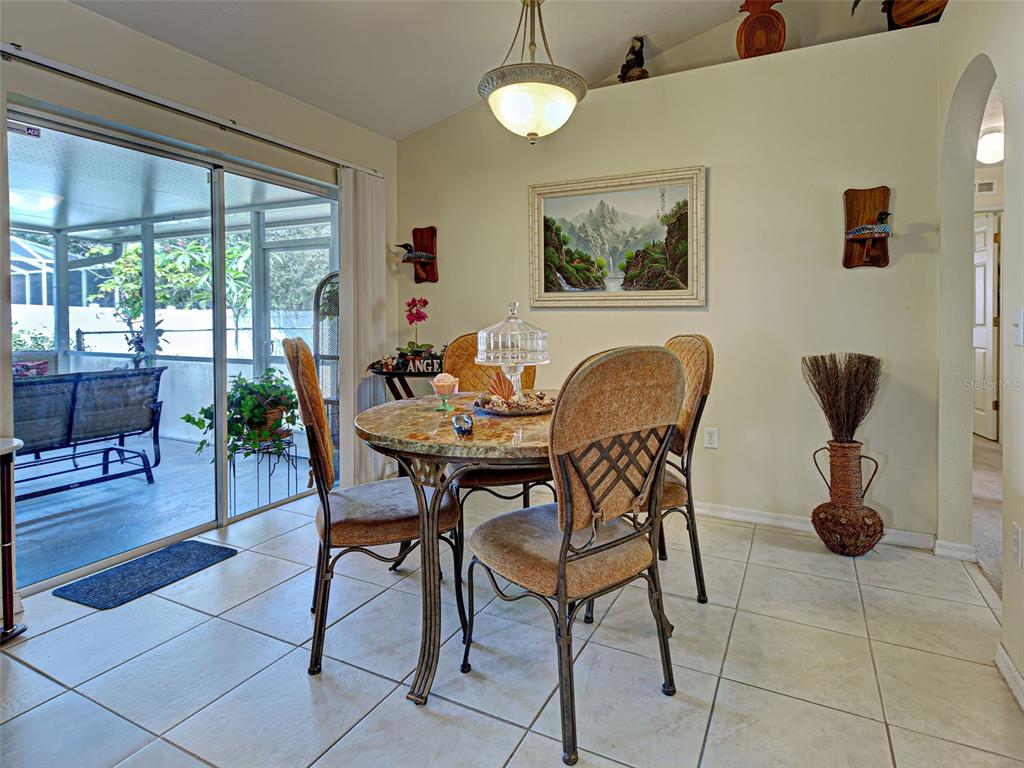 3139 Point Street North Port, FL 34286 - Photo 28 of 58 a dining room with furniture and wooden floor