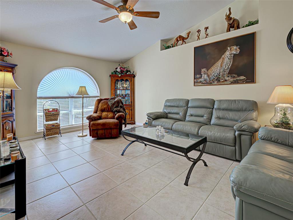 3139 Point Street North Port, FL 34286 - Photo 29 of 58 a living room with furniture and a flat screen tv