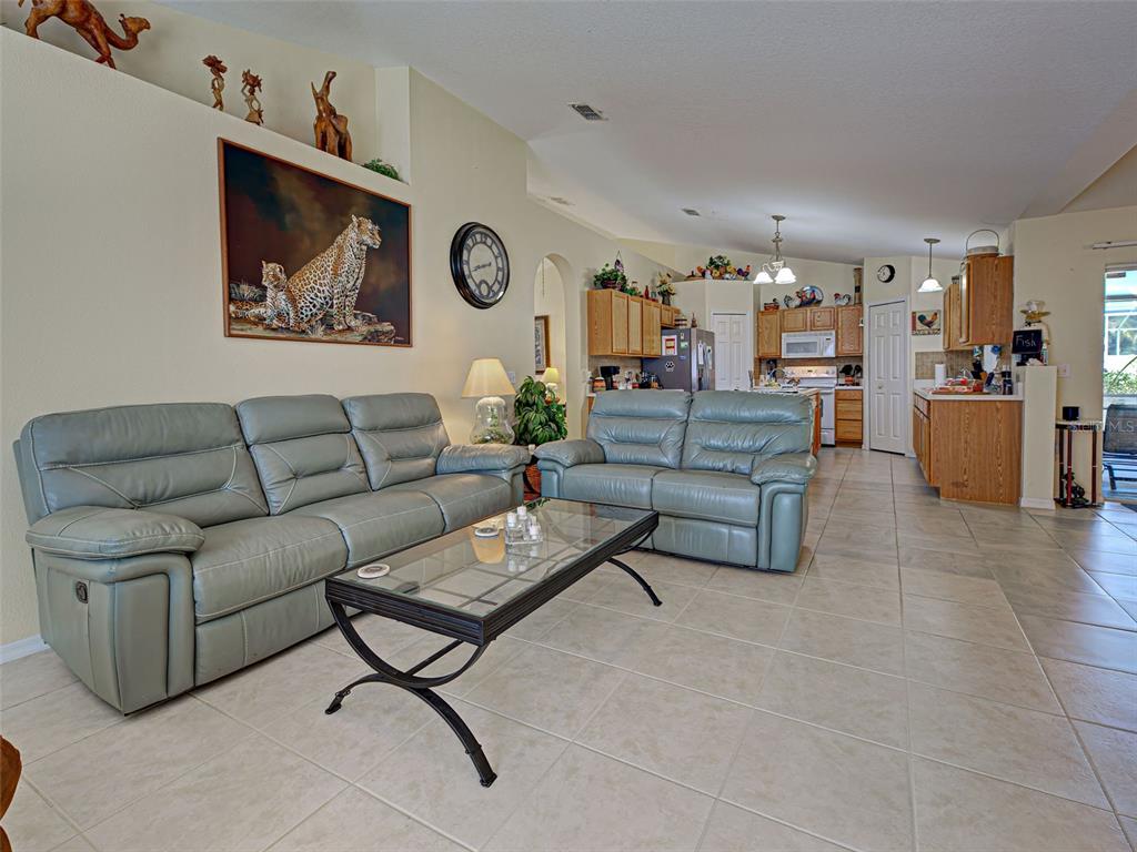 3139 Point Street North Port, FL 34286 - Photo 30 of 58 a living room with furniture and a couch