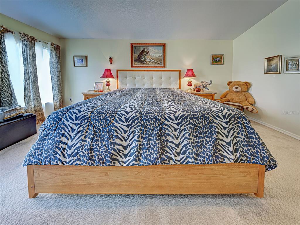 3139 Point Street North Port, FL 34286 - Photo 33 of 58 a bed sitting in a bedroom next to a window