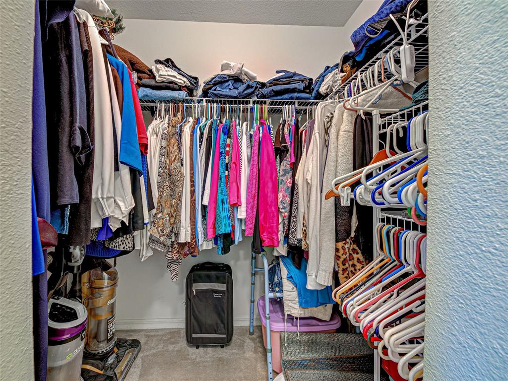 3139 Point Street North Port, FL 34286 - Photo 36 of 58 a view of walk in closet with clothes