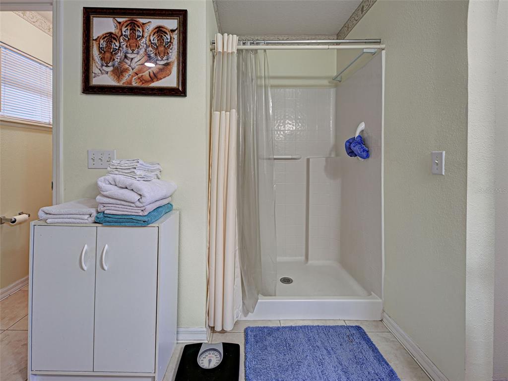 3139 Point Street North Port, FL 34286 - Photo 38 of 58 a bathroom with a shower and a bath tub