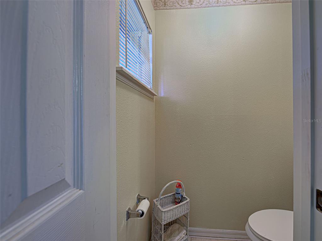 3139 Point Street North Port, FL 34286 - Photo 40 of 58 a bathroom with a toilet and a sink