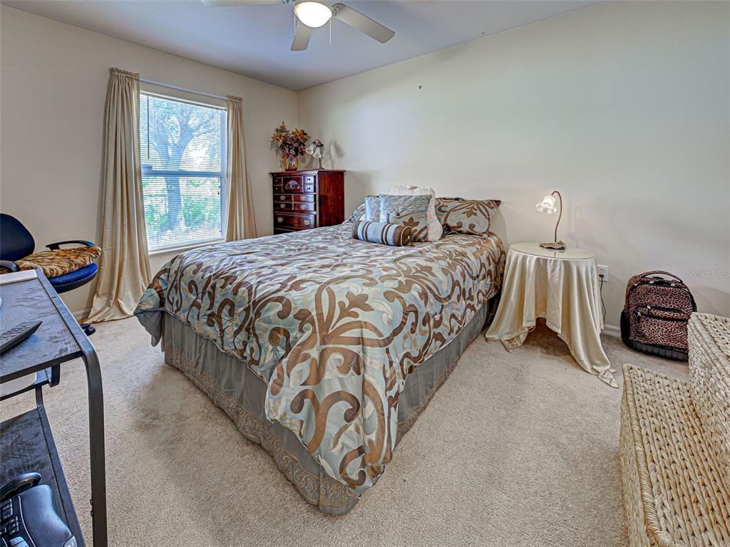 3139 Point Street North Port, FL 34286 - Photo 42 of 58 a bed sitting in a bedroom next to a window