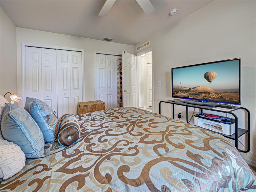 3139 Point Street North Port, FL 34286 - Photo 43 of 58 a bedroom with a bed and a lamp on dresser