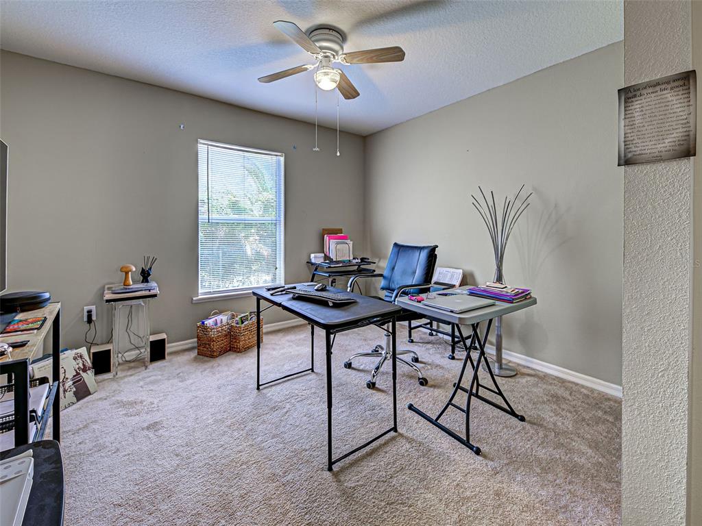 3139 Point Street North Port, FL 34286 - Photo 49 of 58 a view of a workspace with furniture and a window