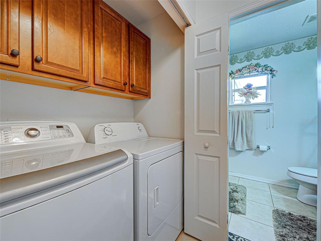 3139 Point Street North Port, FL 34286 - Photo 51 of 58 a utility room with dryer and washer