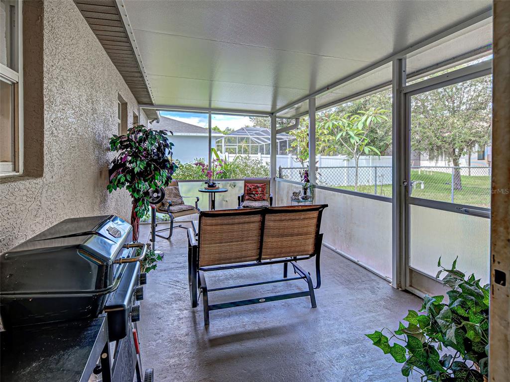 3139 Point Street North Port, FL 34286 - Photo 56 of 58 a living room with furniture and a potted plant