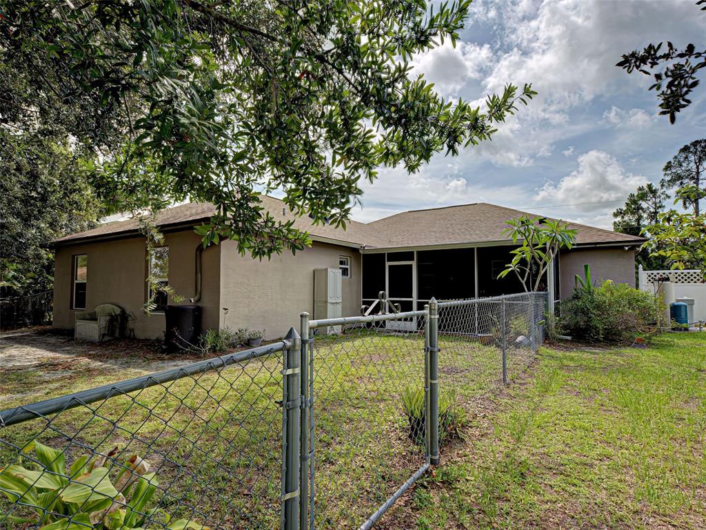 3139 Point Street North Port, FL 34286 - Photo 9 of 58 a view of a house with swimming pool and sitting area