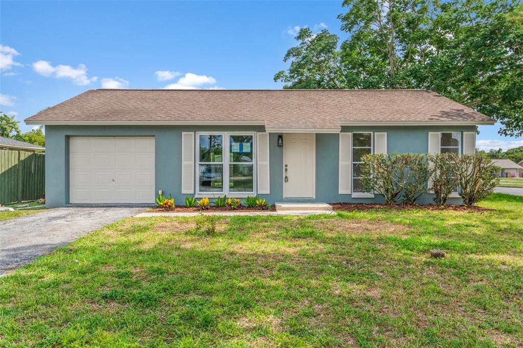 front view of a house with a yard